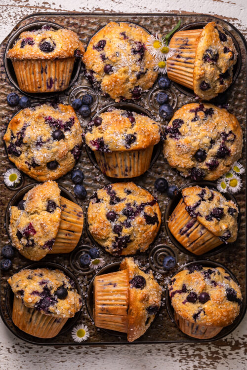 Not too sweet and delightfully moist, these Banana Blueberry Muffins are the perfect breakfast treat! Fresh blueberries work best, but frozen blueberries will work in a pinch. Be sure to fill the muffin cups all the way up to the top for giant domed muffin tops!